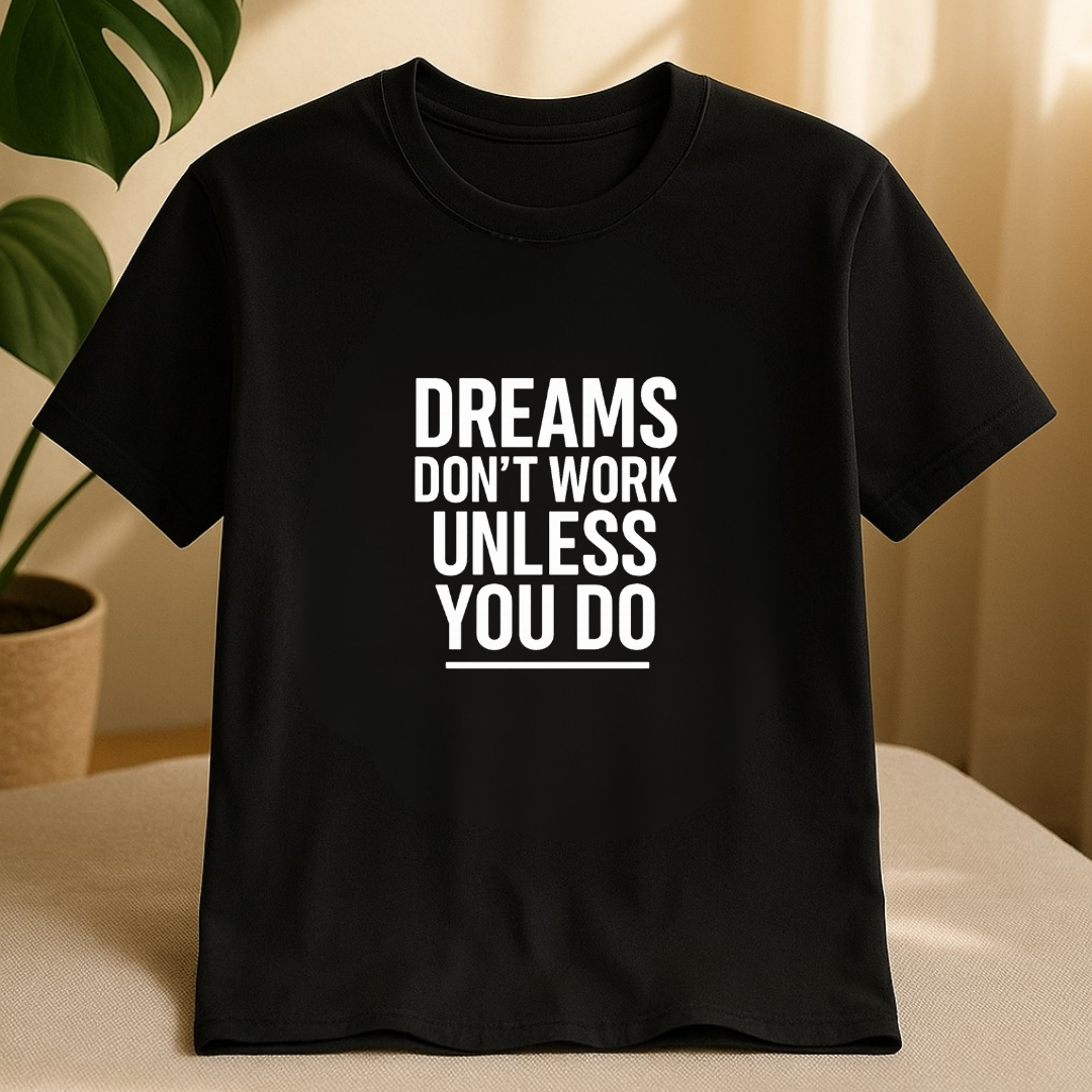 Front view of black motivational t-shirt with bold Dreams Don’t Work Unless You Do design