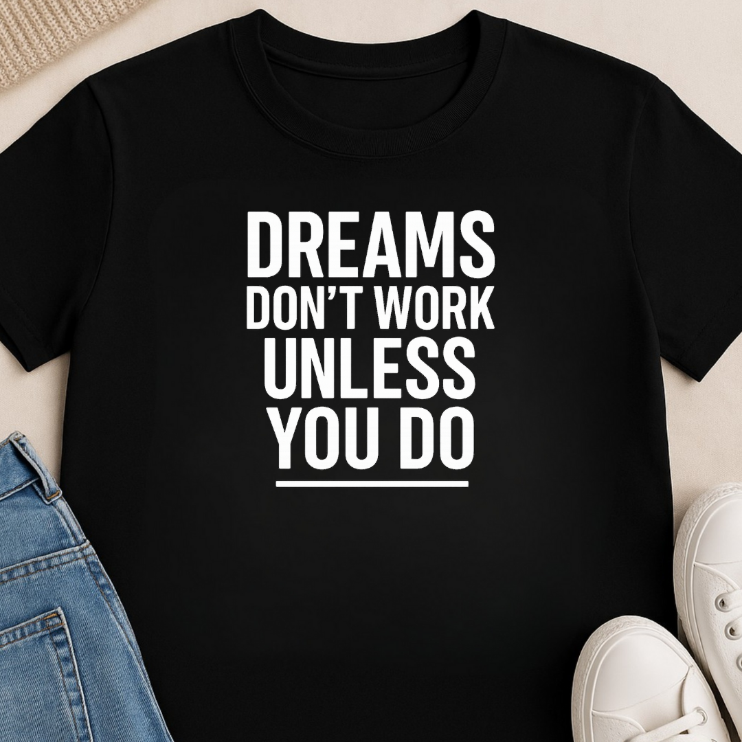 Black motivational t-shirt paired with jeans and sneakers featuring Dreams Don’t Work Unless You Do