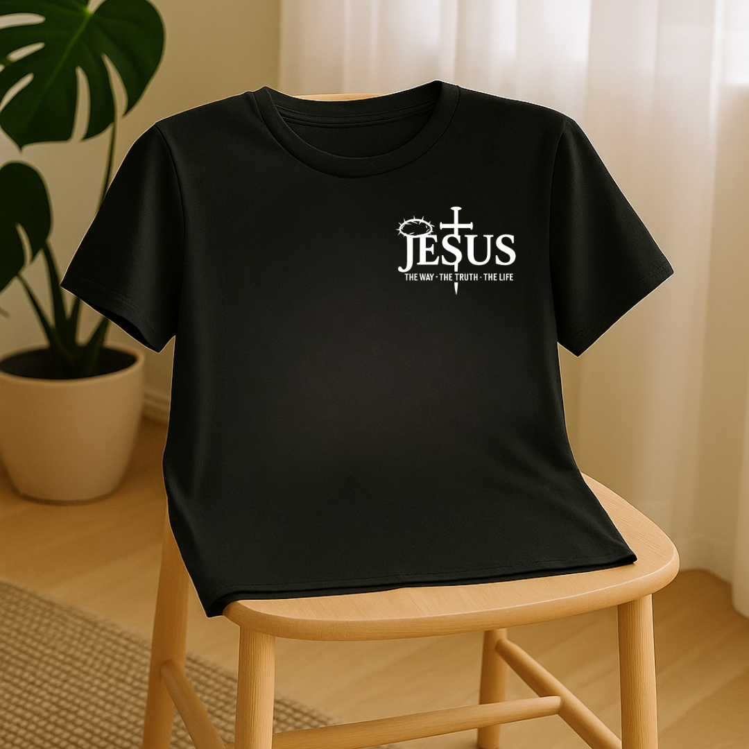 Black Christian T-shirt displayed on chair in minimal home setting