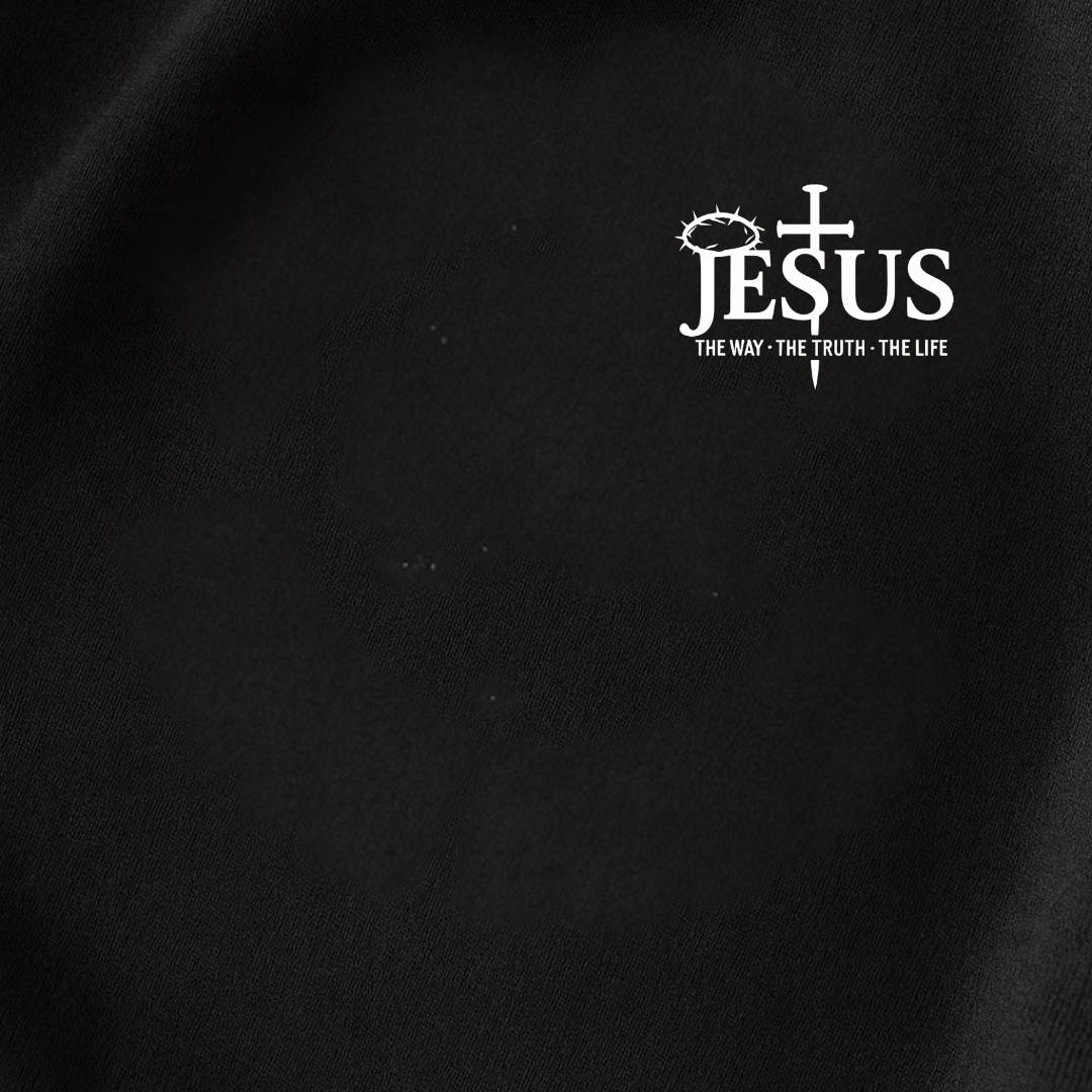 Close-up fabric detail of black Christian T-shirt with Jesus The Way The Truth The Life design