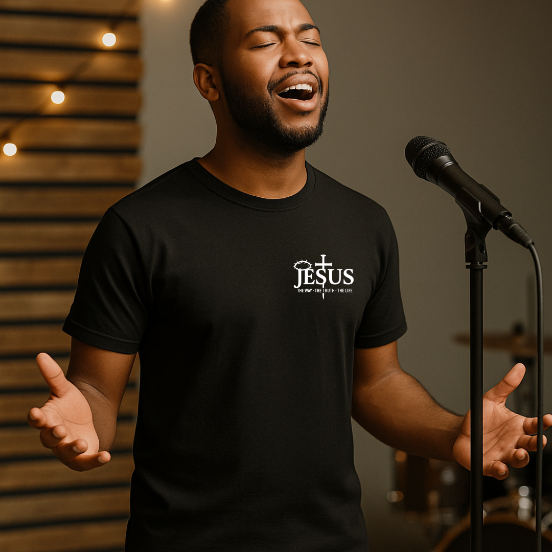 Man wearing black Christian Jesus T-shirt during worship performance
