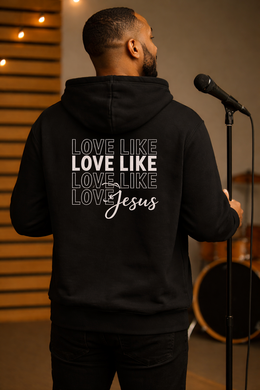 Black Love Like Jesus hoodie worn on stage showing the back faith message design
